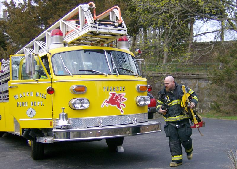 Lieutenant Brian Holdredge with the 1970 American LaFrance Ladder 104.